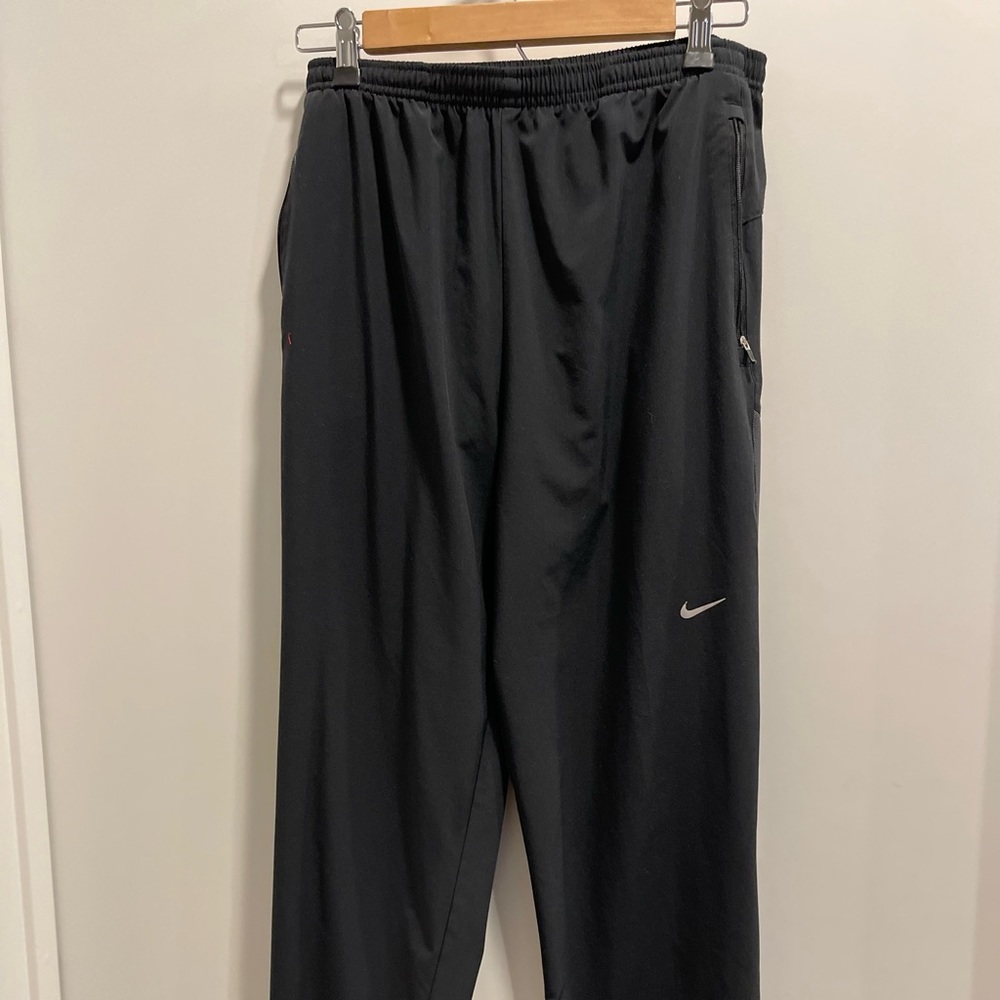 Nike. Black. Athleisure. Wide leg, fit dry sweat pants. Size small. Men.